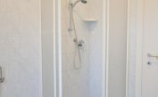 apartments RESIDENCE PINEDA: A2 - bathroom with a shower enclosure (example)